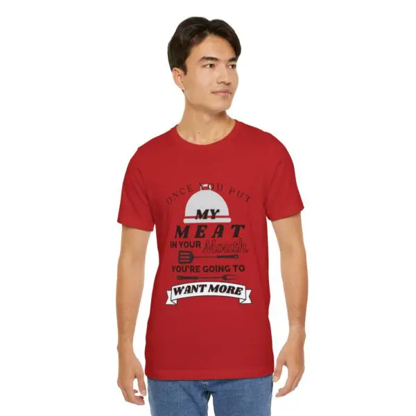 Man wearing a humorous red t-shirt.