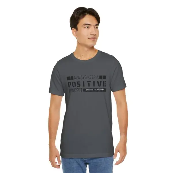 Man wearing "Positive Mindset" grey t-shirt.