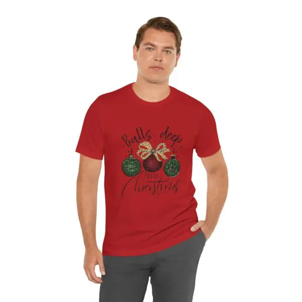 Man wearing red Christmas-themed T-shirt.