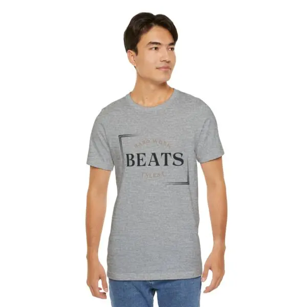 Man wearing a grey "BEATS" t-shirt.