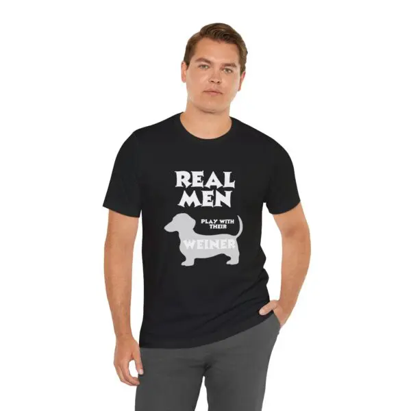 Man wearing a humorous dog-themed t-shirt.