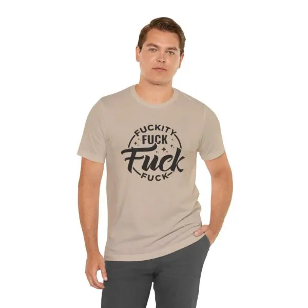 Man wearing shirt with bold text design.