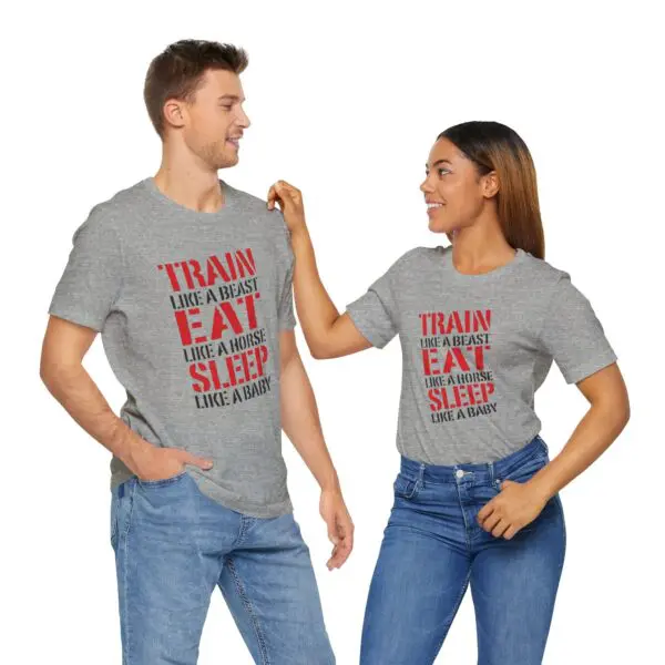 Couple wearing matching motivational t-shirts smiling.