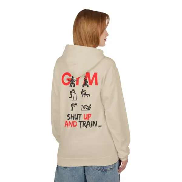 Person wearing gym-themed hoodie, side view.