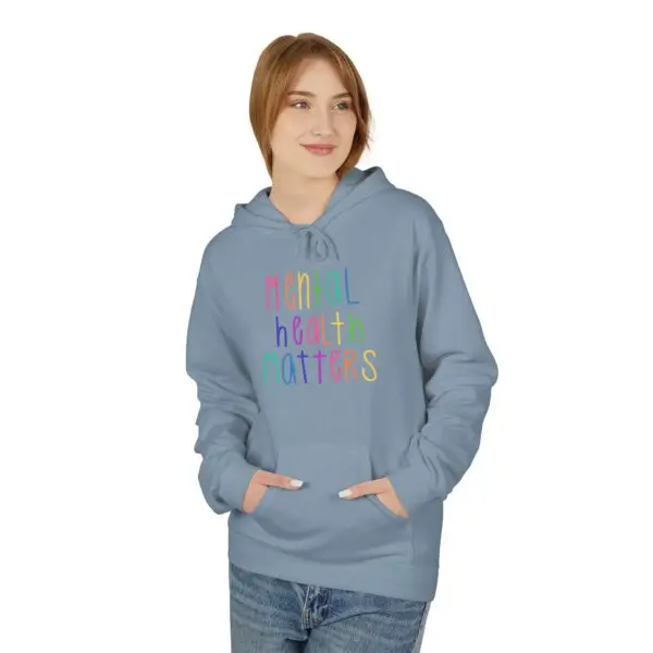 Woman wearing "Mental Health Matters" hoodie.