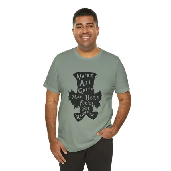 Man wearing a graphic T-shirt, smiling.