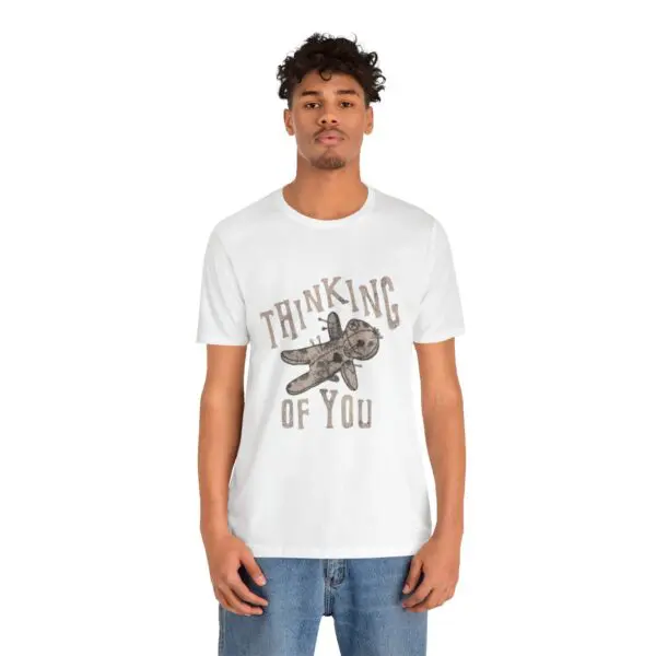 Man wearing "Thinking of You" t-shirt.