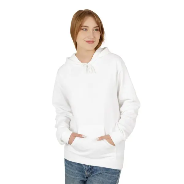 Woman wearing white hoodie and blue jeans.