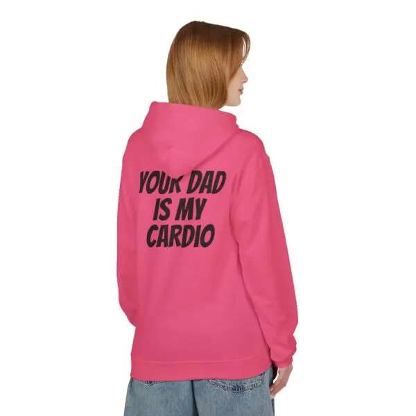 Woman in pink hoodie with text.