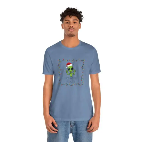 Man wearing alien-themed holiday t-shirt.