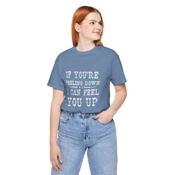 Woman wearing a blue graphic t-shirt.