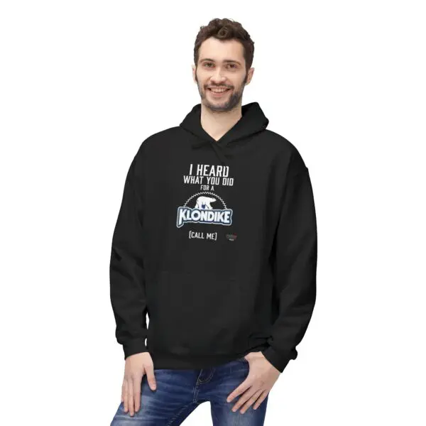 Man wearing a black hoodie, smiling.